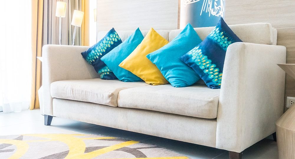 blue-cushions-one-yellow-cushion